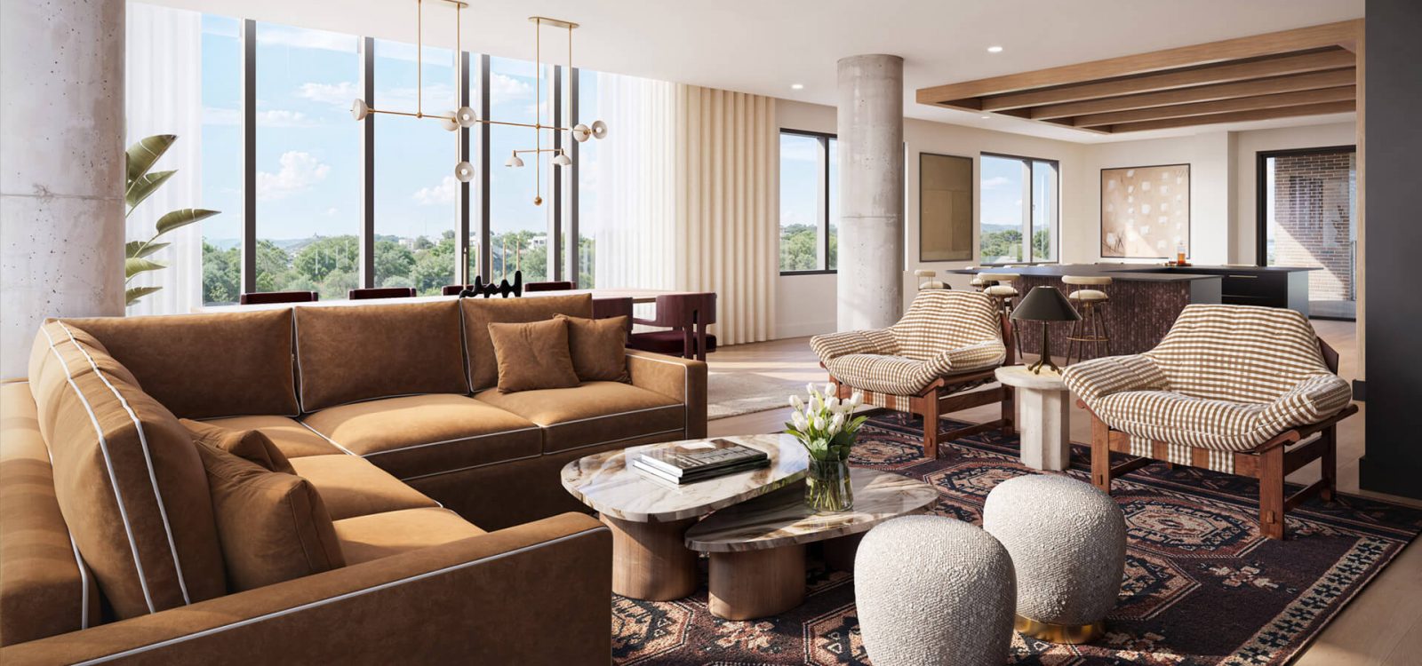 Spacious living room with brown leather seating, patterned rug, modern coffee tables, and large windows showcasing panoramic views of the surrounding area.